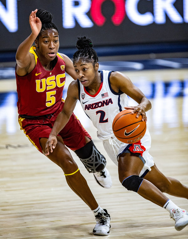 USC Trojans forward Jordan Sanders (5) attempt to guard Arizona Wildcats guard Aari McDonald (2) as she runs the ball up court during a game at the McKale Center, on Dec. 6, 2020. Courtesy Josh Galemore / Arizona Daily Star