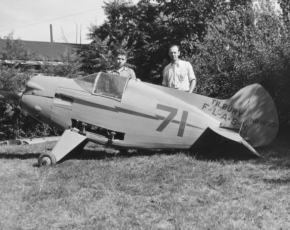 Owen Tilbury on the right with the Tilbury Flash, a racing monoplane he designed, 1934. Richard Weber is his assistant. Courtesy of the McLean County Museum of History, Pantagraph Collection