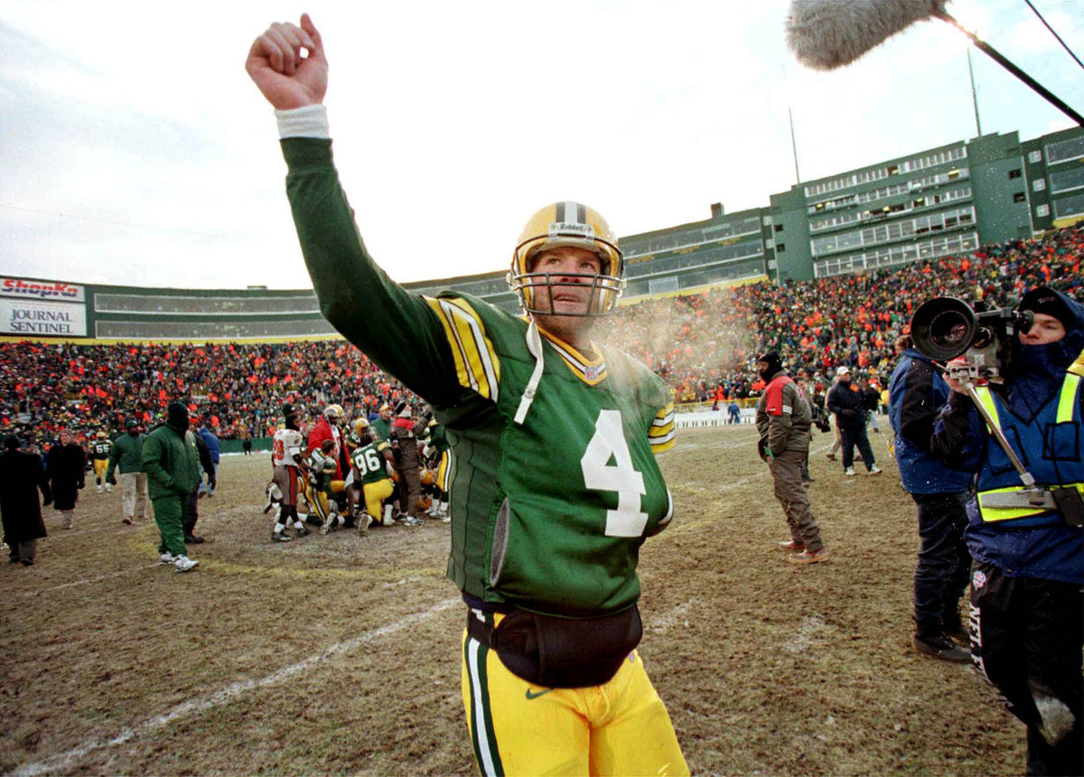 Green Bay quarterback Brett Favre walks off the field Sunday after the Packers beat the Tampa Bay Buccaneers 17-14 in overtime in the last game before renovations begin at Lambeau Field.