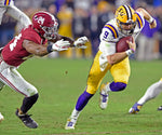 LSU quarterback Joe Burrow (9) runs for a first down as Alabama linebacker Terrell Lewis (24) attempts to make the stop during the second half of LSU's football game against Alabama at Bryant-Denny Stadium on Nov. 9, 2019, in Tuscaloosa, Ala. LSU won 46-41. Courtesy Bill Feig/The Advocate