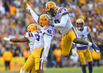 LSU linebacker Michael Divinity Jr. (45) celebrates with linebacker Patrick Queen (8) and safety Marcel Brooks (9) after sacking Auburn quarterback Bo Nix in the second half of LSU's 23-20 victory over Auburn on Oct. 26, 2019, at Tiger Stadium in Baton Rouge, La. Courtesy Hilary Scheinuk/The Advocate