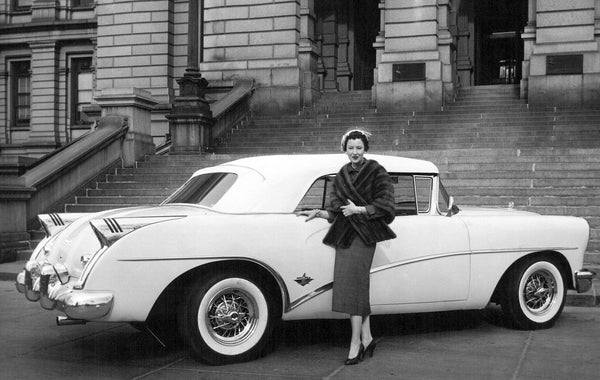 Model Fay Berger displaying the 1954 Skylark, Buick’s new sports car on display, April 9, 1954. Powered by a 200-horsepower engine on a 122-inch chassis, the Skylark had power brakes, power steering, and power operation of the top, windows, radio antenna, and seat. COURTESY THE DENVER POST VIA GETTY IMAGES, CLOYD TETER, #DPL_1118450