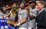 Gonzaga players Josh Perkins and Joel Ayayi, along with coach Mark Few, celebrate with the WCC championship trophy after defeating BYU, March 6, 2018, at the Orleans Arena in Las Vegas. Dan Pelle / The Spokesman-Review