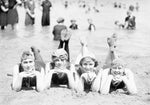 Young ladies relax on the Belle Isle Bathing Beach. Courtesy The Detroit News