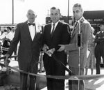 Mayor of Bend William E. “Bill” Miller (center) using a ten-pound knife to cut the ribbon at the formal opening of the Equitable Building, corner of Wall and Newport in Bend, September 1, 1960. At left is Equitable president Ralph H. Cake and at right is Bend Chamber of Commerce president Jesse L. Yardley. Courtesy The Miller Family