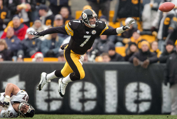 No play ever seems dead with quarterback Ben Roethlisberger. Here, he escapes the Baltimore Ravens defensive tackle Kelly Gregg to release a shovel pass to running back Jerome Bettis at Heinz Field in Pittsburgh, Pa., on Dec. 2, 2004. Peter Diana/Post-Gazette