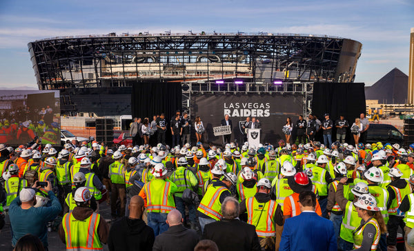 Joined by players and cheerleaders, team owner Mark Davis addresses a crowd during the naming ceremony changeover from Oakland Raiders to Las Vegas Raiders at Allegiant Stadium on Jan. 22, 2020. L.E. Baskow/Las Vegas Review-Journal