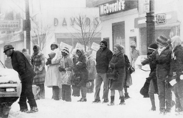 People endure the elements waiting for a bus on February 3. NFT Metro had to call back 150 busses caught in traffic jams in what was characterized as a "transportation disaster" by Niagara Frontier Transportation Authority Chairman Chester R. Hardt. Courtesy Ron Moscati photo, The Courier-Express Photograph Collection. Archives & Special Collections Department, E. H. Butler Library, SUNY Buffalo State
