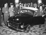 Lou Horwitz, president of Playboy Motor Car Corp., proudly shows off the 1947 Playboy at the Hotel Statler in February 1947. Courtesy David Kaplan