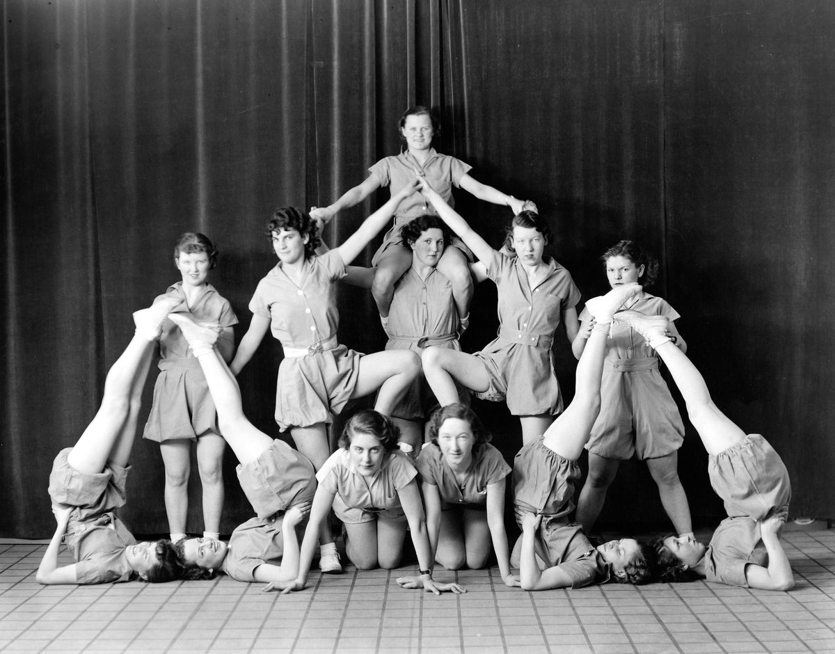 Girls from the Bismarck High School tumbling team pose in a human pyramid, 1935. Courtesy State Historical Society of North Dakota / #C1294