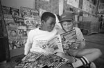 Comic book fans Freddie Lewis, 12 (left), and Marshall Beck, 12, both of Normal Heights, set aside super hero comics to check out a copy of Howard the Duck at the 1976 convention. The year was notable for the first preview of the first Star Wars film that debuted in 1977. A Joe Shuster sketch of Superman sold for $250—he was a co-creator of the Man of Steel. Union-Tribune, photo by Dennis Huls