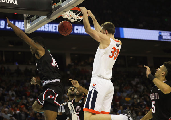 Virginia's forward Jay Huff (30) dunks the ball in the first half against Gardner-Webb in the first round of the men's NCAA Tournament at Colonial Life Arena. Virginia went into the half with a six-point deficit. Courtesy Zack Wajsgras/The Daily Progress