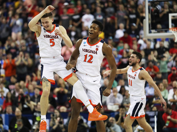 Virginia's guard Kyle Guy (5) and guard De'Andre Hunter (12) celebrate a score in the second half at Colonial Life Arena. After going into the half with a lead, Virginia surged back and advanced to the second round, beating Gardner-Webb 71-56. Courtesy Zack Wajsgras/The Daily Progress