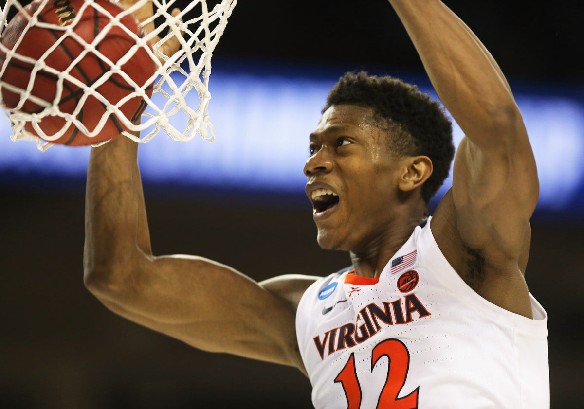 Virginia guard De'Andre Hunter (12) dunks the ball late in the second half at Colonial Life Arena on Sunday. Virginia held a comfortable lead throughout the game and finished with a 63-51 victory, advancing the Wahoos to the Sweet Sixteen. Courtesy Zack Wajsgras/The Daily Progress