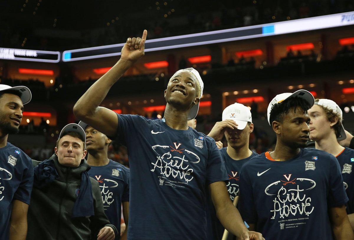 Virginia forward Mamadi Diakite (25) reacts on stage after defeating Purdue 80-75 in the Elite Eight at the KFC Yum! Center on Saturday. ZACK WAJSGRAS/THE DAILY PROGRESS