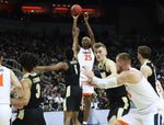 Virginia forward Mamadi Diakite (25) takes a deep shot in the first half at the KFC Yum! Center on Saturday. Virginia went into the half behind 30-29. ZACK WAJSGRAS/THE DAILY PROGRESS