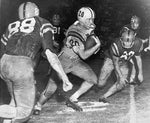 Billy Cannon runs through Ole Miss defenders on his legendary 89-yard punt return on Oct. 31, 1959. The Advocate
