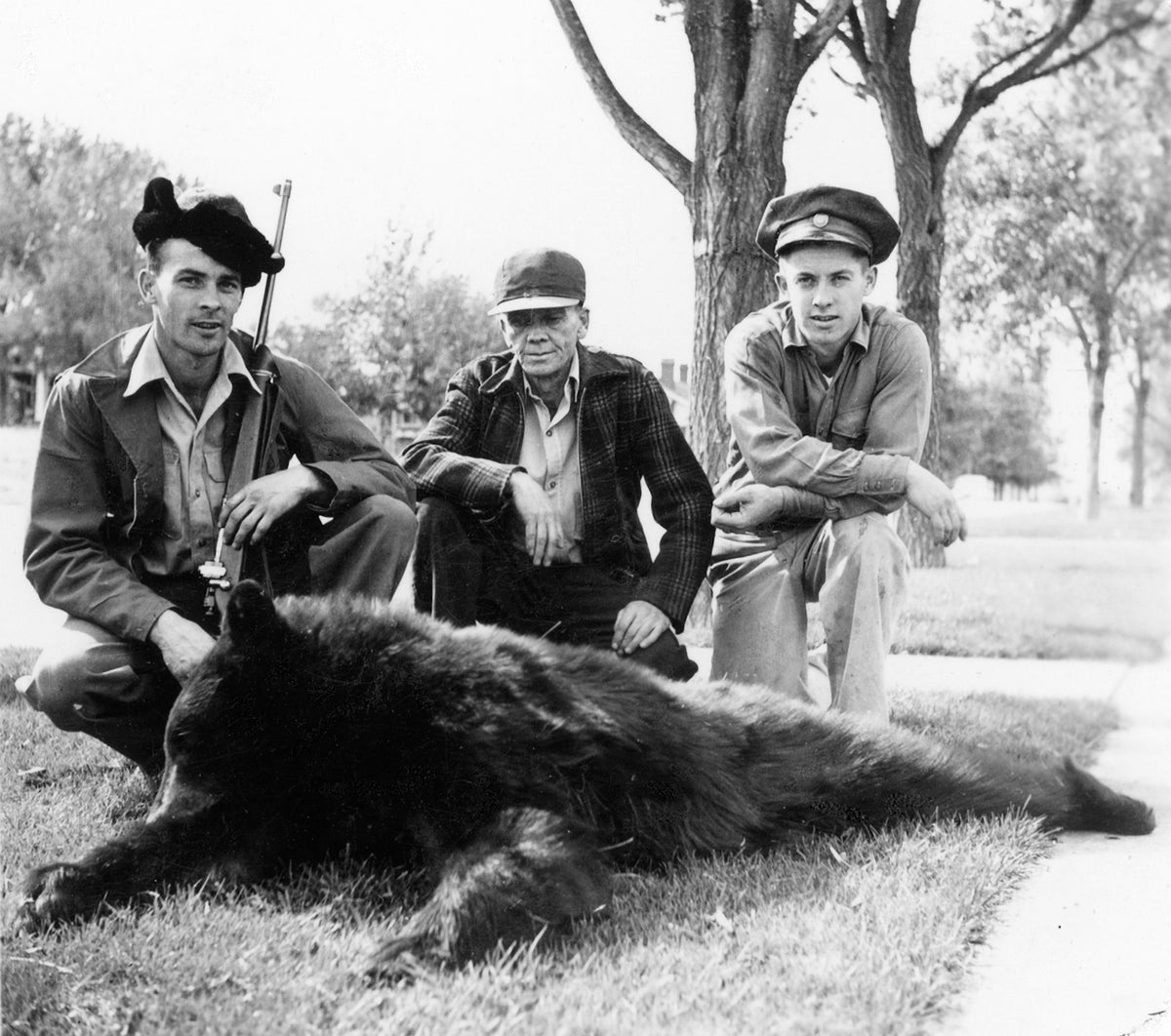 James Oler, Jack Oler, and Lloyd Oler with a bear hunted on Casper Mountain, 1345 South McKinley Street, 1949. Courtesy Debbie Shedden