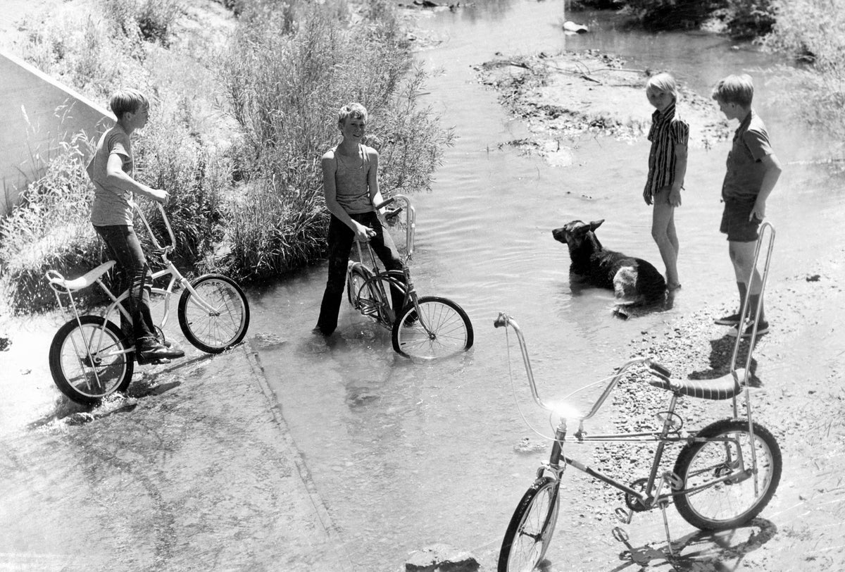 Young cyclists cooling off during the summer, 1970s. Courtesy Casper College Western History Center