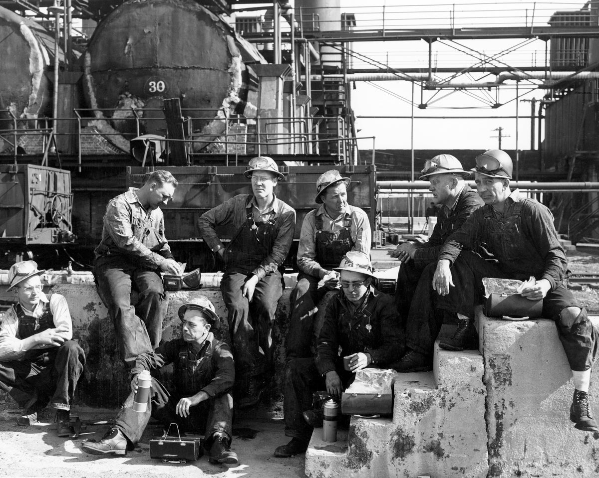 Amoco Oil Refinery pipefitters, December 1953. Seated below, from left: unidentified, Clyde Mayor, Pat Craig. Seated above: Orvil Kludy, Vic Jammerman, unidentified, “Red” Moore, Cliff Leonard. Courtesy Casper College Western History Center
