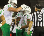 Offensive lineman Matt Pierson (62) congratulates Kenny Bassett (31) on his 9-yard touchdown run in the fourth quarter, which capped the night’s scoring. Randy L. Rasmussen/The Oregonian/OregonLive
