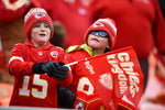 Chiefs' fans Trey Perry, 10, left, and Braiden Sanchez, 8, from Carthage, Missouri watch their first Chiefs game at Arrowhead Stadium. Courtesy Tammy Ljungblad / The Kansas City Star
