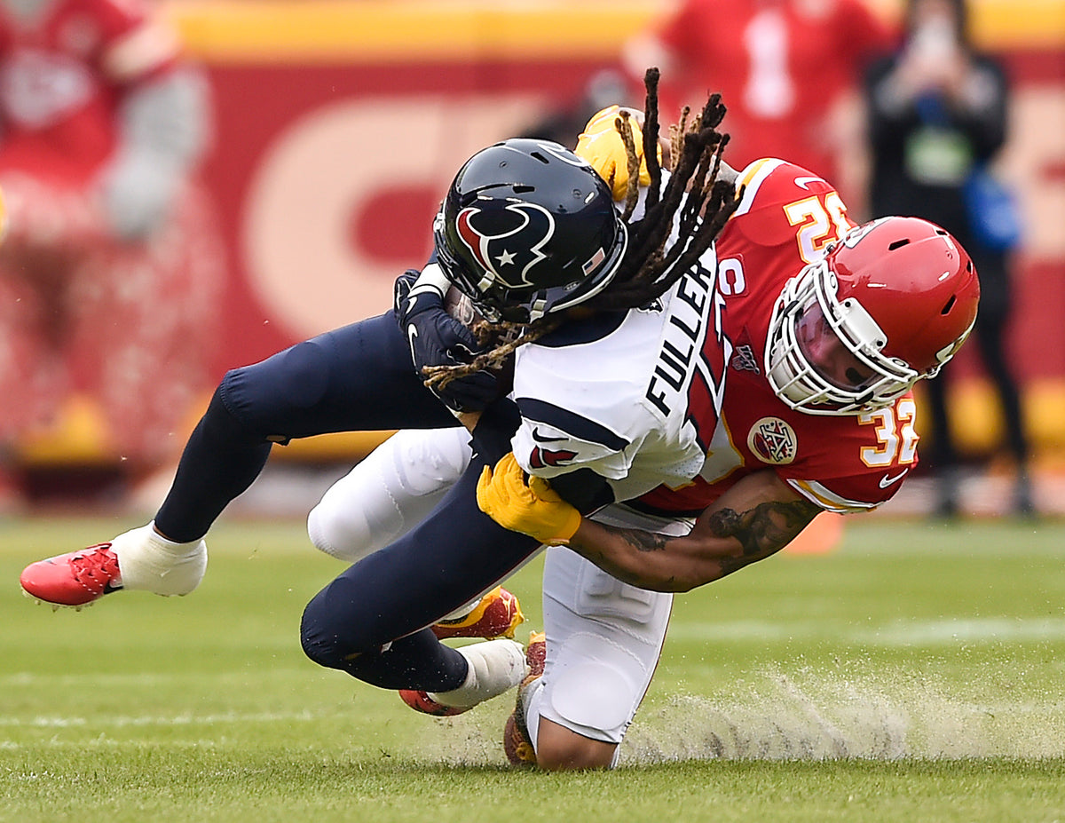 Kansas City Chiefs strong safety Tyrann Mathieu brings down Houston Texans wide receiver Will Fuller in the first quarter on January 12, 2020, at Arrowhead Stadium in Kansas City, Missouri. Courtesy Jill Toyoshiba / The Kansas City Star