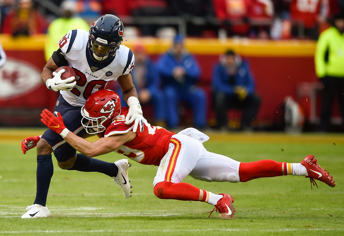 Kansas City Chiefs defensive back Daniel Sorensen wraps up Houston Texans strong safety Justin Reid on January 12, 2020, at Arrowhead Stadium in Kansas City, Missouri. Courtesy Tammy Ljungblad / The Kansas City Star