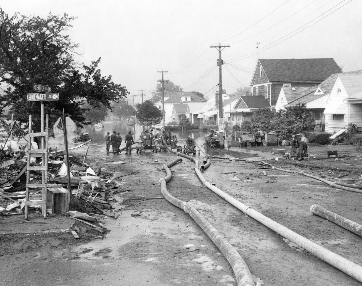 As floodwaters receded, the grim reality and magnitude of the cleanup ahead sets in for residents of the flood plain returning to their flooded homes. This scene is from Church and Shoemaker streets, Swoyersville. The Citizens’ Voice