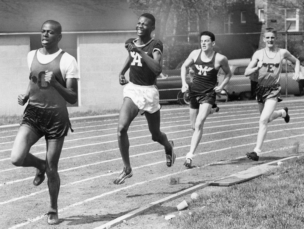 John Adams High School relays, April 1957. From left: Larry McClain, Glenville High School; Tom Hale, John Adams High School; Bob Donnelly, Maple Heights High School; Bill Bigmam, East High School. Courtesy Cleveland Public Library Photograph Collection/#SCL017284