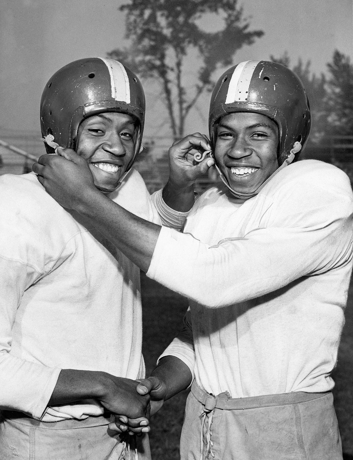Identical twins Jim (left) and Bill Whitley played football for John Adams High School, November 1952. Courtesy Cleveland Public Library Photograph Collection/#SCL015313_9