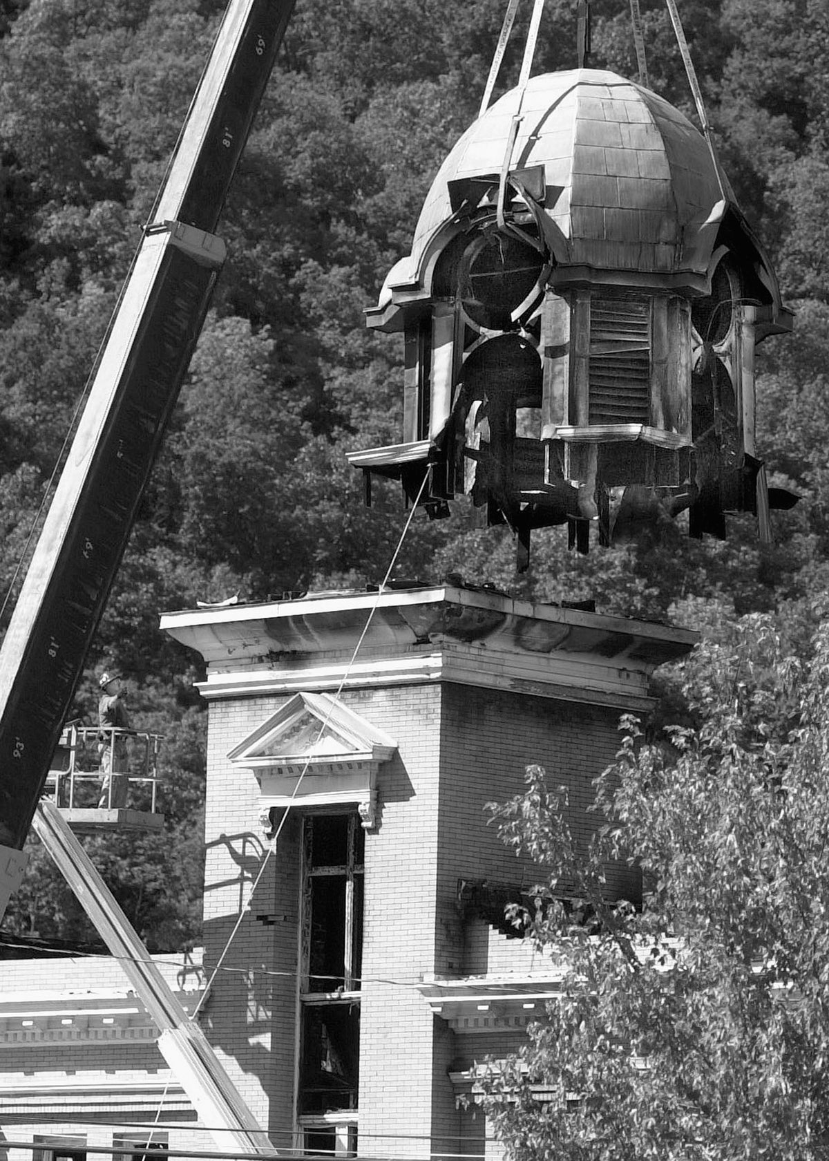 Removal of the Morgan County Courthouse clock tower that was destroyed by a fire, Berkeley Springs, 2006. Martinsburg Journal