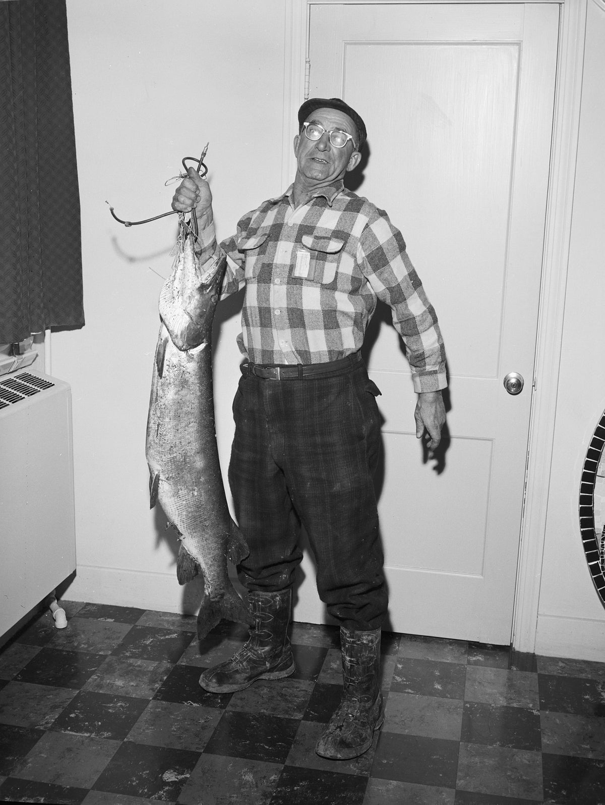 Ernest Baker with a 47 inch muskie at the Meadville Tribune office, November 29, 1962. Courtesy Meadville Tribune