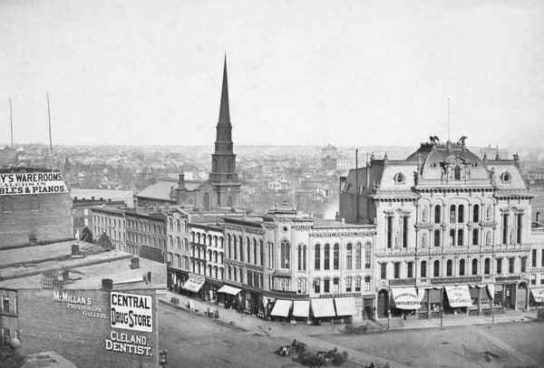 Detroit Opera House and surrounding businesses at Campus Martius between Woodward and Monroe Avenues, 1878. This first Detroit Opera House was a French Renaissance structure designed by Mortimer L. Smith of the firm Sheldon Smith & Son, and first opened on March 29, 1869. On October 7, 1897, a fire in the central business district destroyed the Opera House, along with most of the businesses in the area. Courtesy Detroit Public Library / #DPA4548