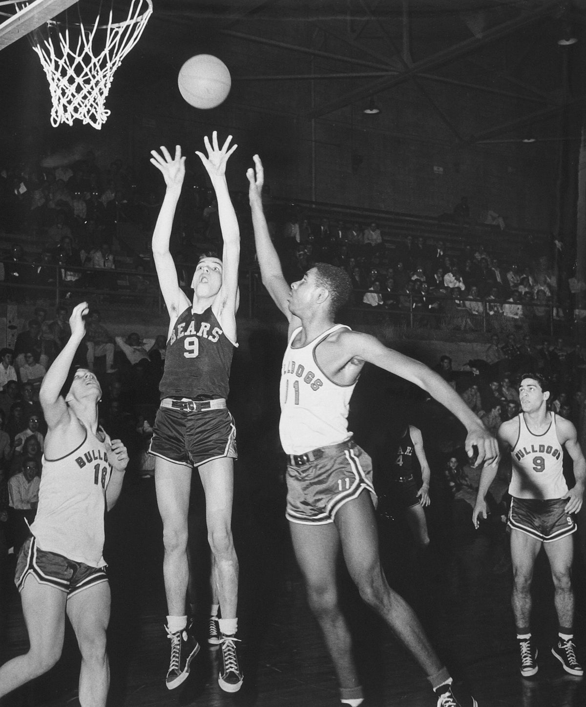 Waynedale player in basketball tournament action, winter 1957. Courtesy The Daily Record
