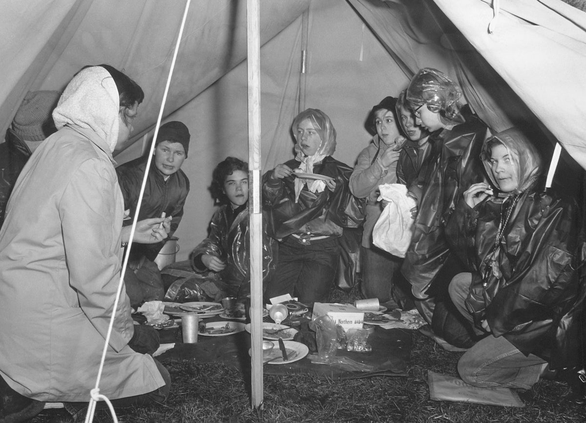 The self-named group of Girl Scouts, Wo-Ma-Ca, camp on Diller Hill, Wooster, April 1956. The group represented Senior Girl Scouts from Wooster, Massillon, and Canton. The late April weather exposed the group to high winds, cold rain, sleet, and snow. Representing Wooster were Scouts Gretchen Harmon and Doris Fullerton. Gladys Ferguson and Cyndy Tice were the local advisors. Courtesy The Daily Record