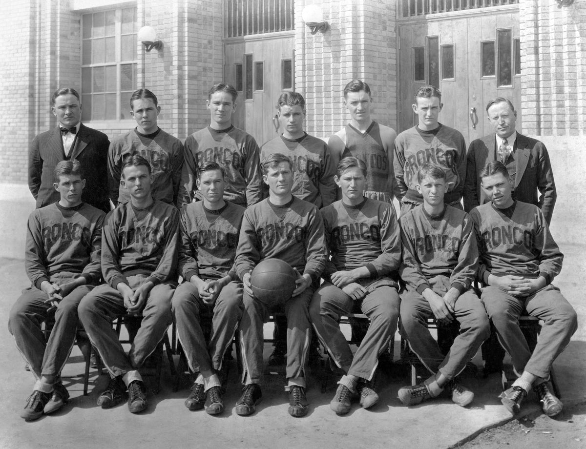 Denton High School Bronco basketball team, circa 1934. Team state champions Dan McAlister Coach (back row, far left) and Professor Calhoun Principal (back row, far right). Courtesy Paul and Beverly Chandler