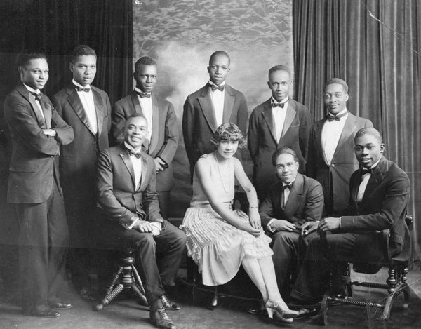 George Morrison (seated on piano stool at left) and his performing group, circa 1920. Courtesy Black American West Museum, Paul W. Stewart Collection