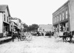 Men on horse-drawn carts overlooking a crowd of people on the street in Columbia, June 14, 1913. Courtesy Tyrrell County Public Library