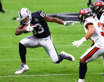 Las Vegas Raiders tight end Darren Waller (83) runs the ball against the Tampa Bay Buccaneers in the first quarter during an NFL football game on Oct. 25, 2020, at Allegiant Stadium in Las Vegas. Chase Stevens/Las Vegas Review-Journal