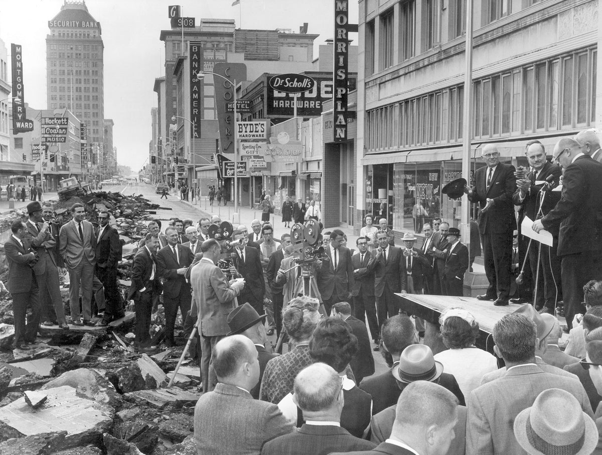 The Fulton Mall groundbreaking ceremony, looking south on Fulton Street from Tuolumne Street, mid-1960s. On the flatbed truck platform, from left: County Supervisor Norman S. Foley, Mayor Wallace D. Henderson, Chairman of the Redevelopment Agency of the City of Fresno Karl Buckman, Executive Director of the Downtown Association of Fresno Larry Willoughby. Courtesy The Fresno Bee
