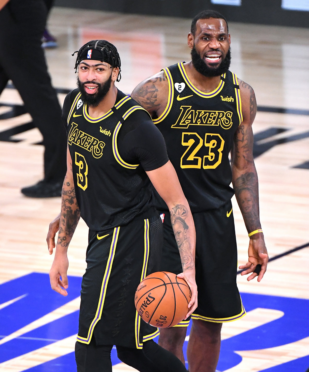 Anthony Davis, left, and LeBron James look pleadingly at the referee for a foul call during Game 2 of the NBA Finals. Wally Skalij / Los Angeles Times
