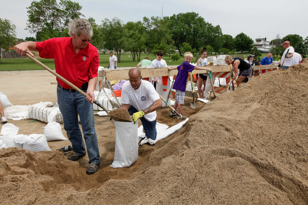 Brent Steffens and George Hamilton filling sandbags along the riverfront in anticipation of an expected flood, Sioux City, June 2, 2011. Sioux City Journal