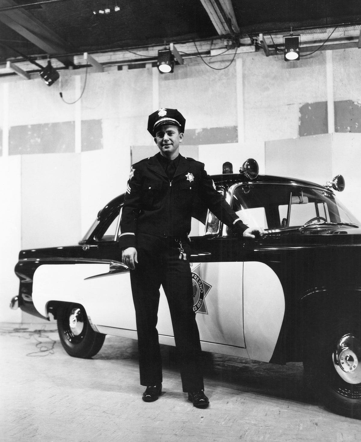 Fresno Police officer with a department vehicle, 1956. Courtesy Fresno Historical Society