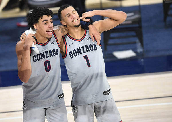 Gonzaga guard Julian Strawther (0) and guard Jalen Suggs (1) mug for a cameraman following the second half on Jan. 23, 2021, at McCarthey Athletic Center in Spokane, Wash. Tyler Tjomsland / The Spokesman-Review