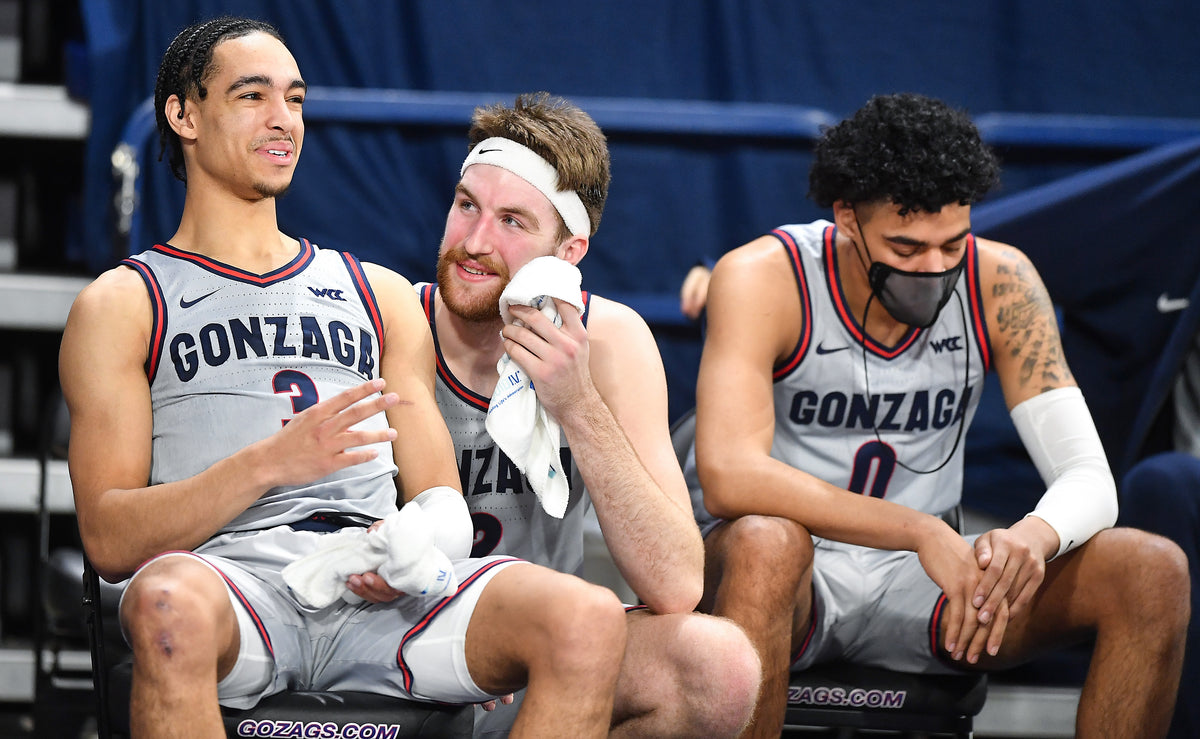Gonzaga Bulldogs forward Drew Timme (2) and guard Andrew Nembhard (3) laugh from the bench during the second half of a college basketball game on Feb. 20, 2021, at McCarthey Athletic Center in Spokane, Wash. Gonzaga won the game 106-69. Tyler Tjomsland/The Spokesman-Review