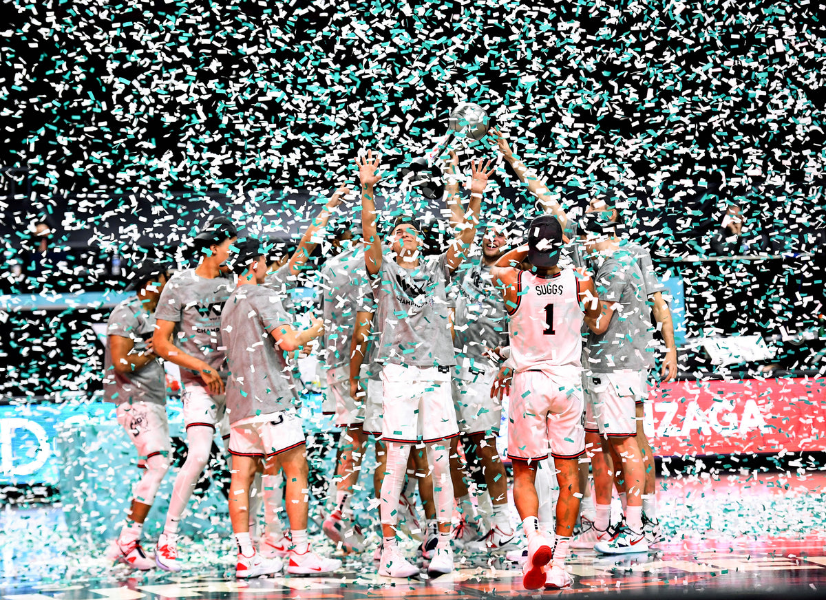 The Zags celebrate their West Coast Conference Tournament Championship win over BYU, March 9, 2021, at the Orleans Arena in Las Vegas. Colin Mulvany/The Spokesman-Review ^^ center light rgba(40,40,35,0.5)