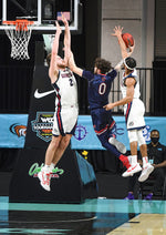 Gonzaga forward Drew Timme (2) and Gonzaga guard Aaron Cook (4) try to stop a shot by St. Mary's guard Logan Johnson (0), but Cook is called for a foul during the second half of a West Coast Conference semifinal NCAA college basketball game, March 8, 2021, at the Orleans Arena in Las Vegas. Colin Mulvany/The Spokesman-Review