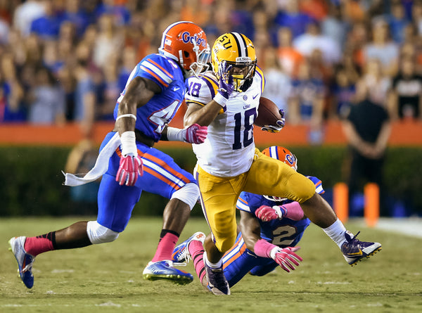 Florida’s Keanu Neal (42) and Jabari Gorman (2) try to bring down Terrence Magee on Oct. 11, 2014, in Gainesville. Travis Spradling / The Advocate