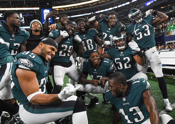 Eagles players are all smiles on the sideline as the clock runs out at AT&T Stadium. Courtesy Clem Murray / Staff Photographer
